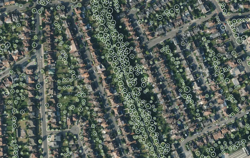ArborLayer tree centre points and equivalent canopy radius circles over the same aerial imagery of West Bridgford, Nottingham